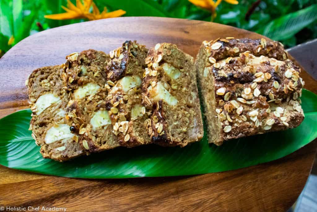 Sliced banana bread on banana leaf