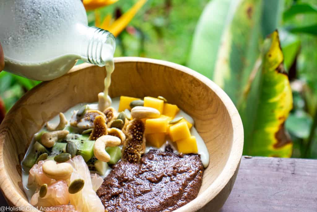 teff porridge with pumpkin seed milk and mango