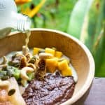 teff porridge with pumpkin seed milk and mango