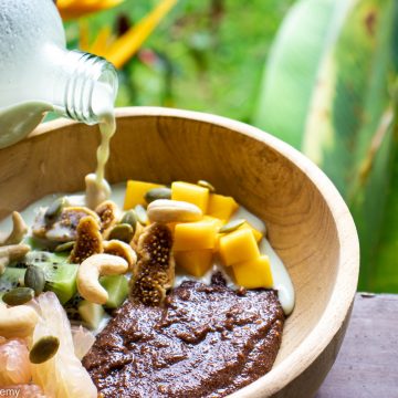 teff porridge with pumpkin seed milk and mango