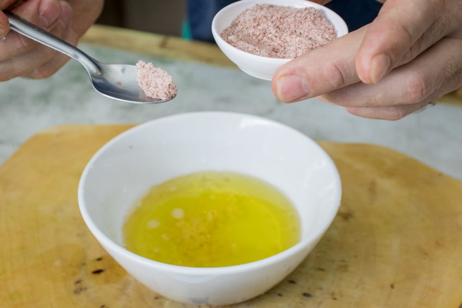 adding salt to the quinoa tabbouleh