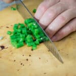 finely slicing cooked green beans
