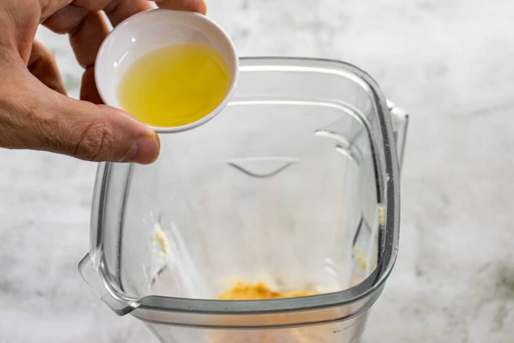 add-the-olive-oil-to-the-blender