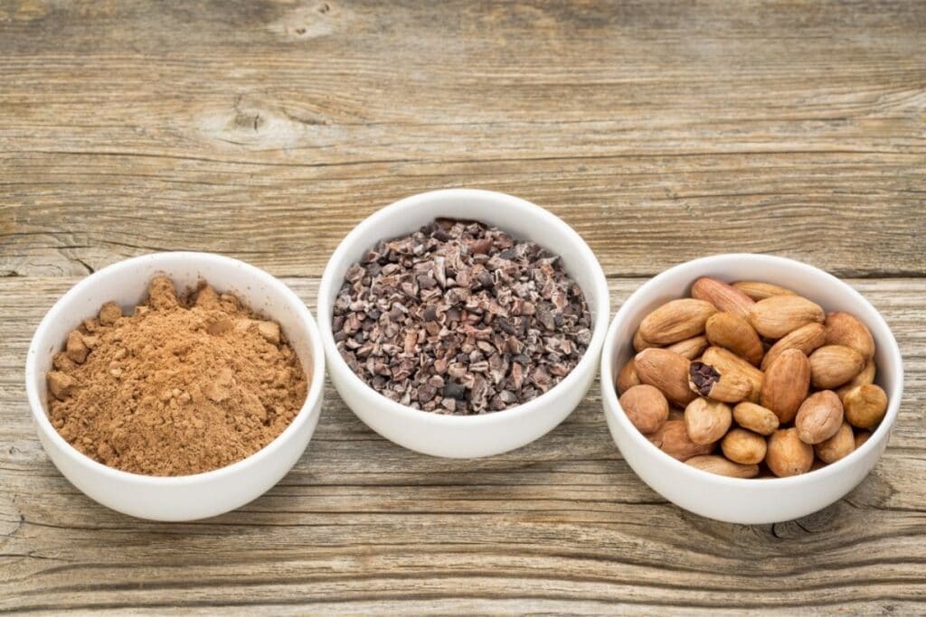 raw-cacao-powder-nibs-and-beans-in-bowls