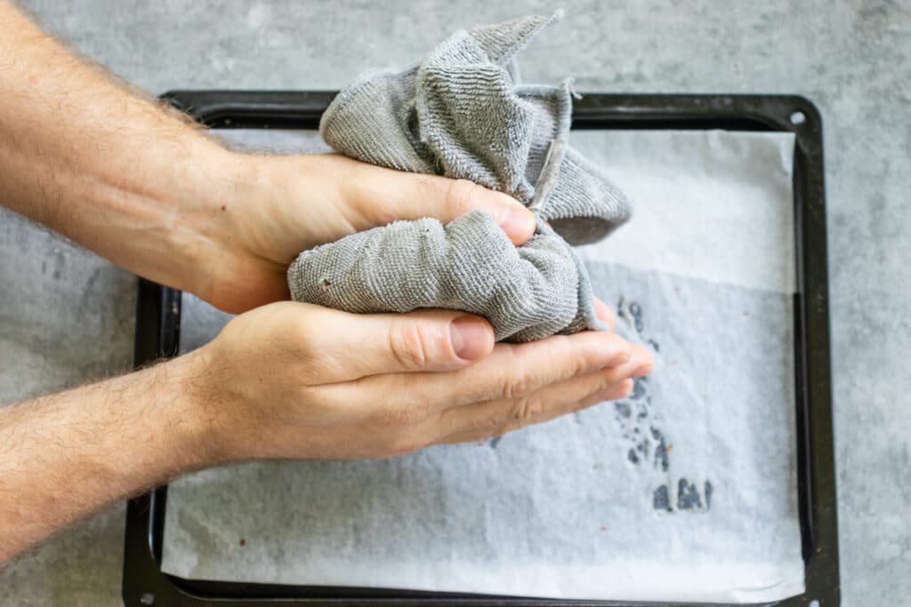 rubbing-hazelnuts-in-a-towel